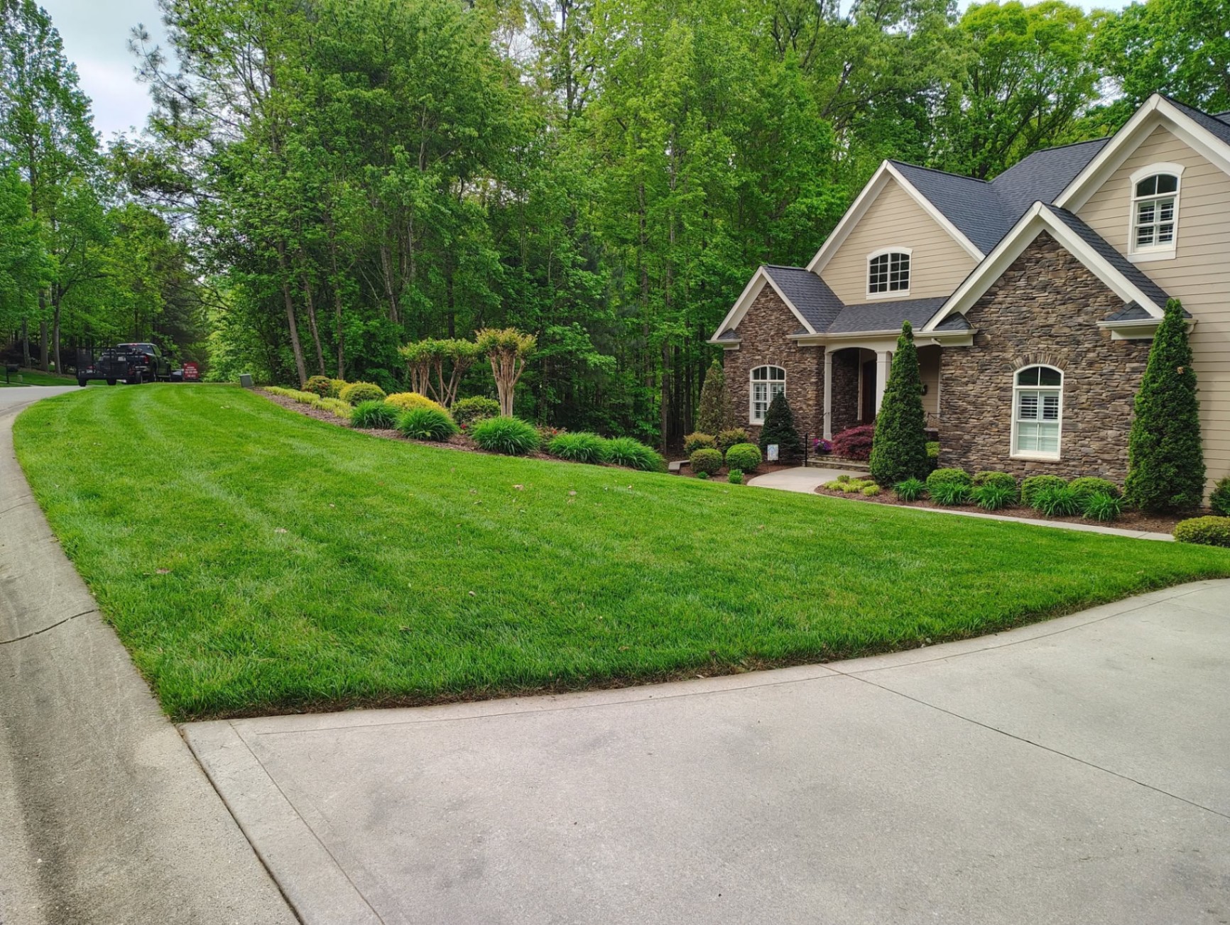 Freshly mowed lawn with crisp stripes in front of a Southern home